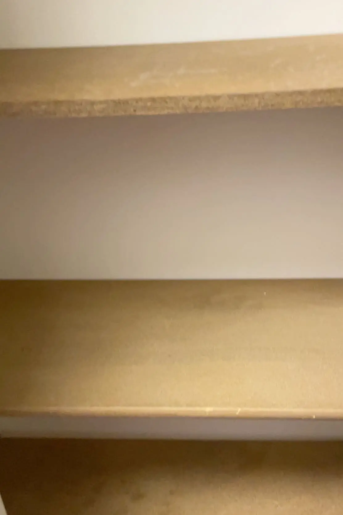 Empty MDF shelves before organizing, showing a clean slate for home storage solutions.